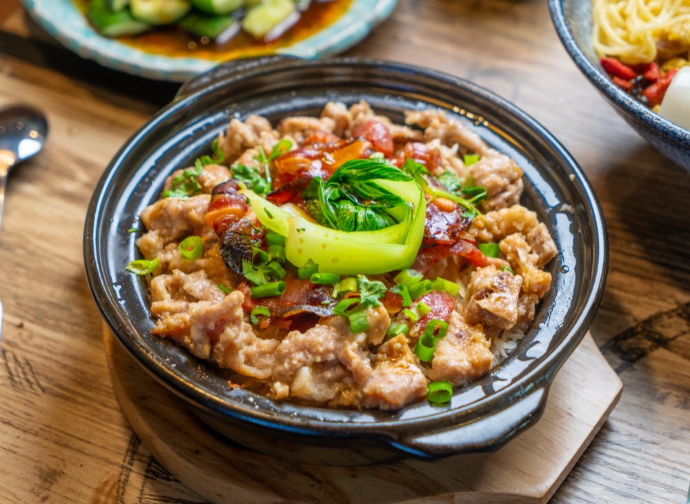 Sliced meat in a clay pot